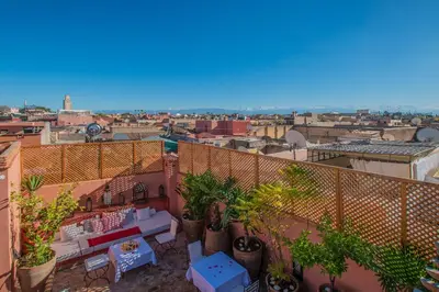 a view of a city from a balcony with plants at Riad Anais Marrakech in Marrakech
