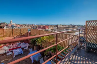 a balcony with a view of a city at Riad Anais Marrakech in Marrakech