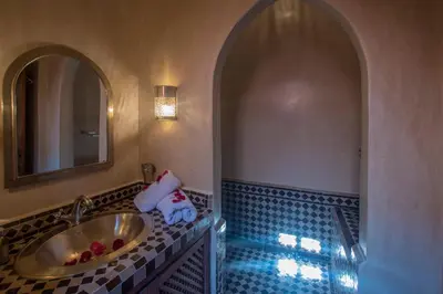 a bathroom with a sink and a mirror at Riad Anais Marrakech in Marrakech