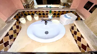 a bathroom with a white sink in a counter at Perle en plein Gueliz in Marrakech