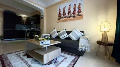 a living room with a couch and a table at Perle en plein Gueliz in Marrakech