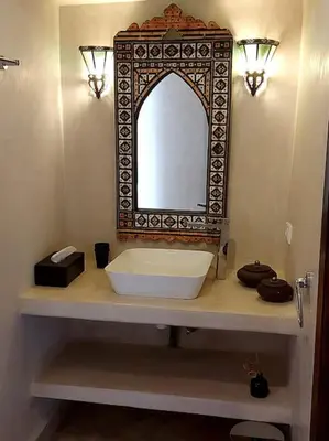 a bathroom with a sink and a mirror on a counter at Riad Sophora - Peaceful Heaven in Marrakech in Marrakech