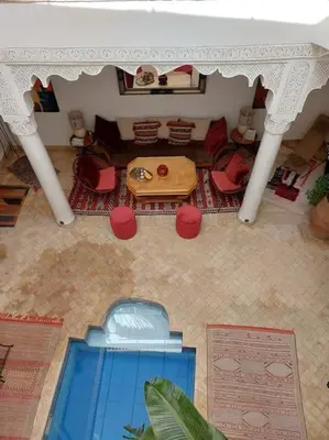 a model of a living room with a table and chairs at Riad Sophora - Peaceful Heaven in Marrakech in Marrakech