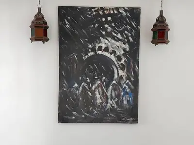 a painting hanging on a wall with two lights at Riad Sophora - Peaceful Heaven in Marrakech in Marrakech