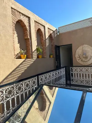 a balcony of a house with a wrought iron railing at Riad Kamilyes in Marrakech