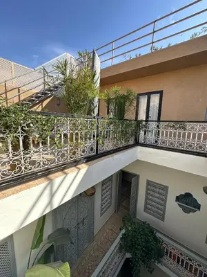 a balcony of a building with plants on it at Riad Kamilyes in Marrakech
