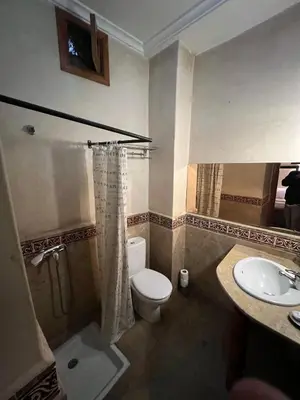 a bathroom with a toilet and a sink at Riad Radia in Marrakech