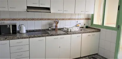 a white kitchen with a sink and a microwave at ☆HIVERNAGE☆ Charming , Spacious & Bright with Pool in Marrakech