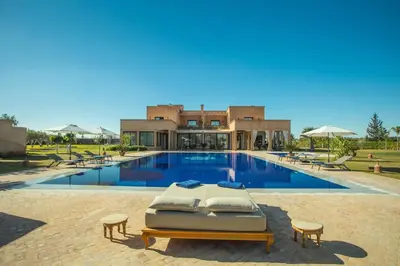 a villa with a swimming pool and a resort at L'Orientale By La Siredrah in Marrakech