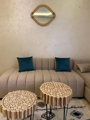 a living room with a couch and two tables at Luxury & cosy apartment in Marrakech