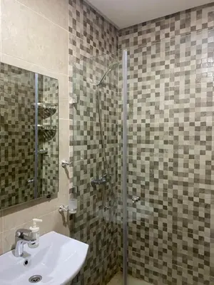 a bathroom with a sink and a shower at Luxury & cosy apartment in Marrakech