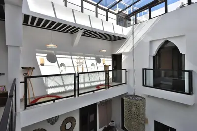 a view of a room with windows and a balcony at Riad Modern Bed & Breakfast - Top location in Marrakech