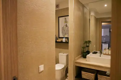 a bathroom with a white toilet and a sink at Dar Lala Mama in Marrakech
