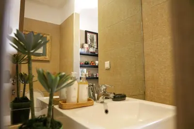 a bathroom with a sink and a mirror at Dar Lala Mama in Marrakech