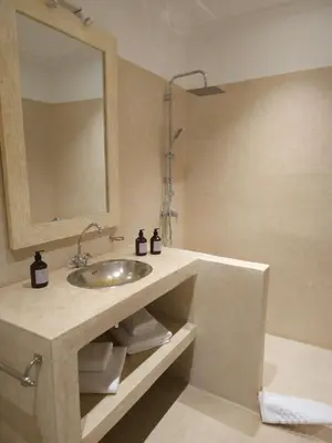 a bathroom with a sink and a mirror at Riad Coconut in Marrakech