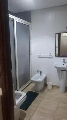 a bathroom with a toilet and a sink and a shower at hamza in Marrakech