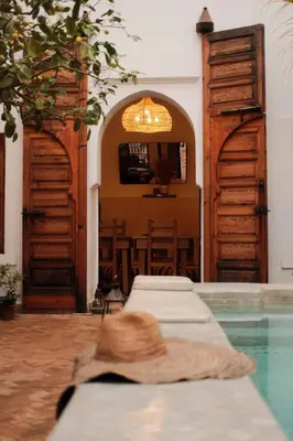 a room with two beds and a swimming pool at RIAD SAMAH in Marrakech