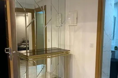 a glass shelf in a room with a mirror at 1Bed Apartment - Sleeps 4 - Balcony Parking Wifi in Marrakech
