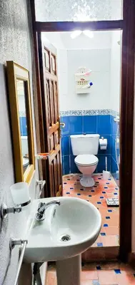 a bathroom with a sink and a toilet at Riad 1954 in Marrakech