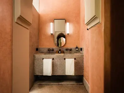 a bathroom with two sinks and a mirror at Riad Brummell Medina in Marrakech