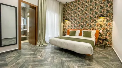 a bedroom with a large bed in a room at Villa AZUR - piscine chauffée sans vis-à-vis à Marrakech in Marrakech