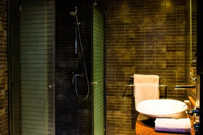 a bathroom with a shower with a toilet and a sink at Tempoo Hotel Marrakech City Centre Adults Only in Marrakech