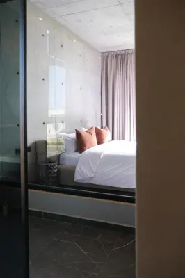 a view of a bedroom with a bed and a mirror at VIP villa in Marrakech