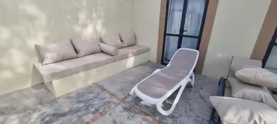 a living room with a couch and a chair at Villa BALI KECH in Marrakech