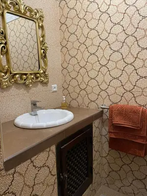 a bathroom with a sink and a mirror at Dar Dadès in Marrakech