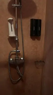 a shower in a bathroom with a soap dispenser at Riad khoya magnifique in Marrakech
