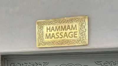 a sign that says hamann massage on a wall at Luxe Nomade Marrakech & Spa in Marrakech
