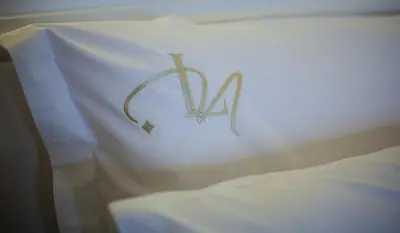 a pillow with the letter n on top of it at Luxe Nomade Marrakech & Spa in Marrakech