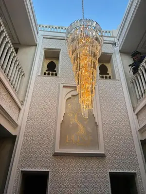 a chandelier hanging from the ceiling of a building at Luxe Nomade Marrakech & Spa in Marrakech