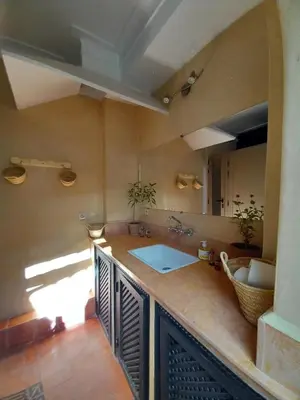 a kitchen with a sink and a counter top at Riad Hostel JAD ZIAD in Marrakech