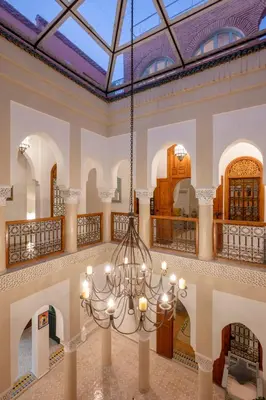a large room with a chandelier in a building at Riad Dar Azal in Marrakech