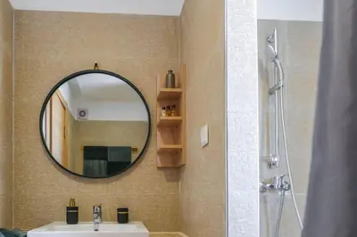 a bathroom with a sink and a mirror at Appart très élégant avec piscine in Marrakech