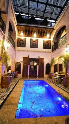 a large swimming pool in a large building at Riad Touhfa Kasbah Marrakech in Marrakech