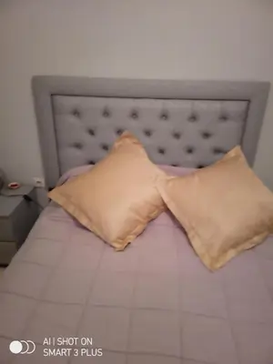 a bed with a pillow with a bow tie on it at Chrifia in Marrakech