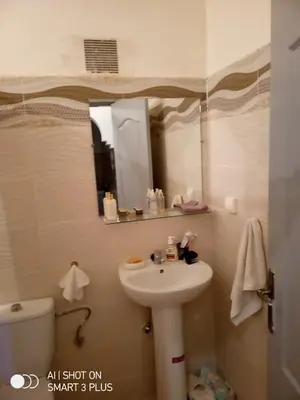 a bathroom with a sink and a mirror at Chrifia in Marrakech
