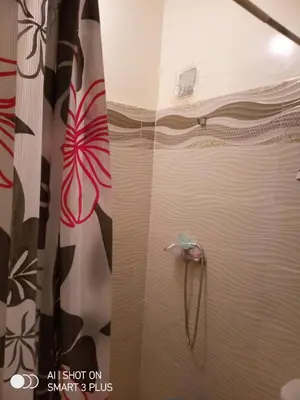 a shower in a bathroom with a shower curtain at Chrifia in Marrakech