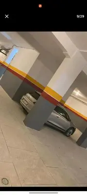a car is parked under a wing of a plane at belle appartement a Marrakech in Marrakech