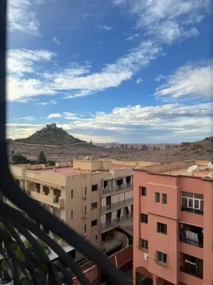 a view from the balcony of a pink building at Appartement Marrakech Gueliz 5 Min Drive to City Center in Marrakech