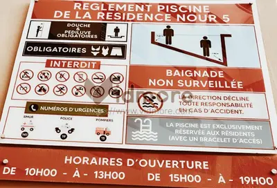a sign that warns of a restrictedrance zone at NOOR 5 Residence in Marrakech