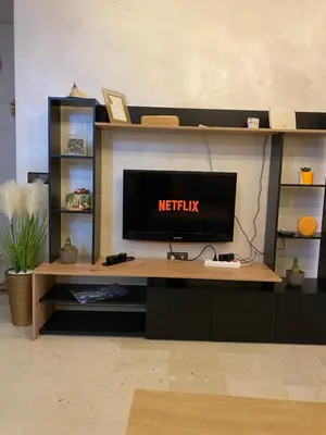 a desk with a television in a living room at NOOR 5 Residence in Marrakech