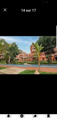 a picture of a palm tree in front of a building at premium village 106 in Marrakech