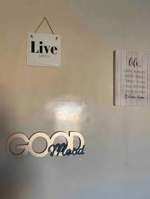 a sign on a wall with a company logo on it at Studio au centre in Marrakech