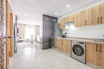 a kitchen with a washer and dryer at Brand New! Charming and Comfortable Flat in Gueliz in Marrakech