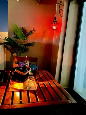 a wooden table with a potted plant on top of it at Deluxe KING Bed SUITE W/POOL in Marrakech