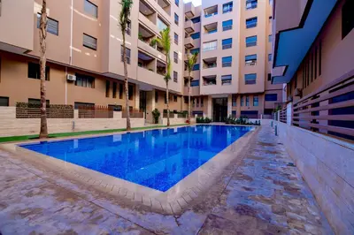 a swimming pool in the middle of a building at Deluxe KING Bed SUITE W/POOL in Marrakech