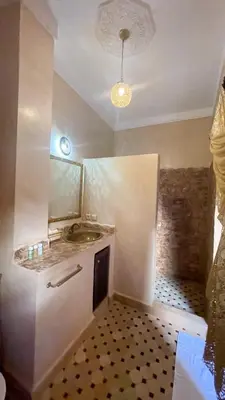 a kitchen with a sink and a counter top at RIAD GJULJA in Marrakech